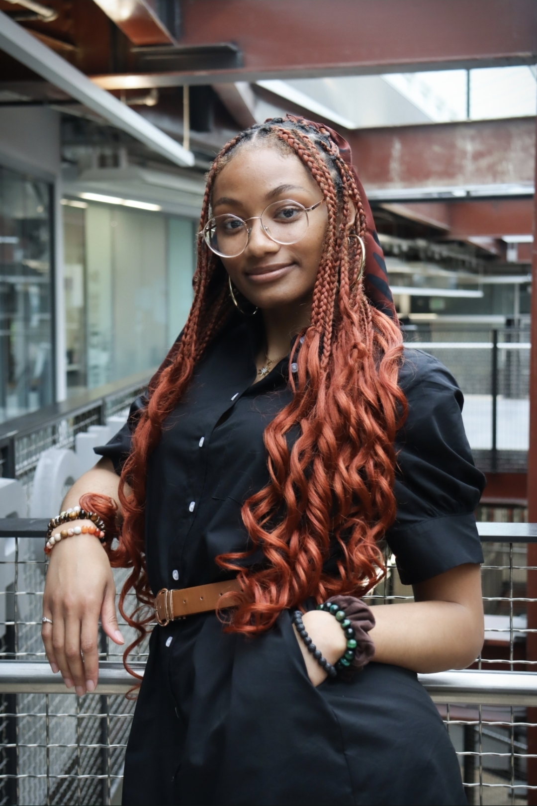 woman posing for headshot in office building